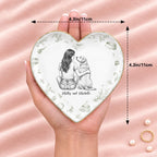 Hand holding a vintage sketch person and pet heart ring dish, 4.3 inches across