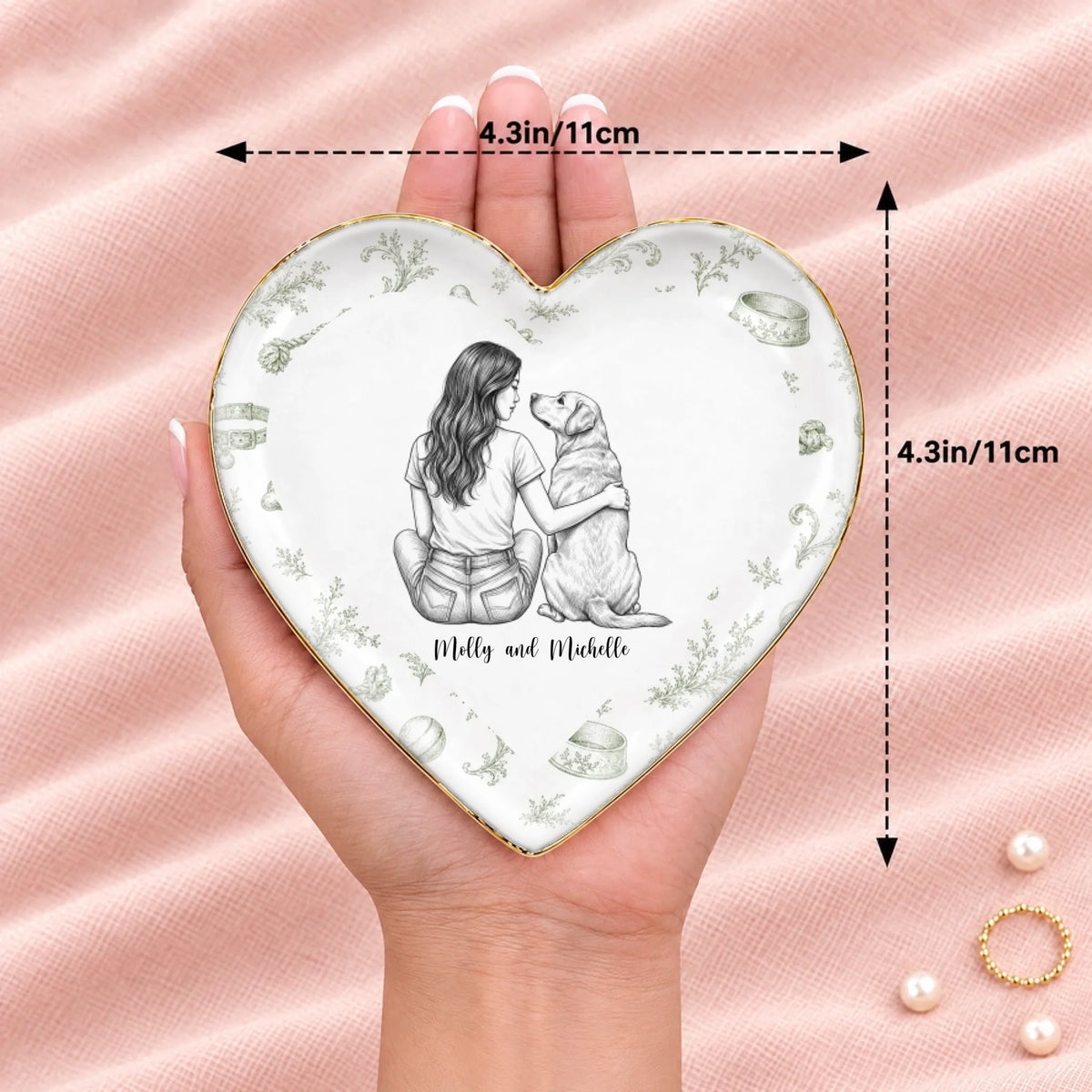 Hand holding a vintage sketch person and pet heart ring dish, 4.3 inches across