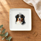 Square watercolor splash pet portrait ring dish on a wooden table with linen and eucalyptus
