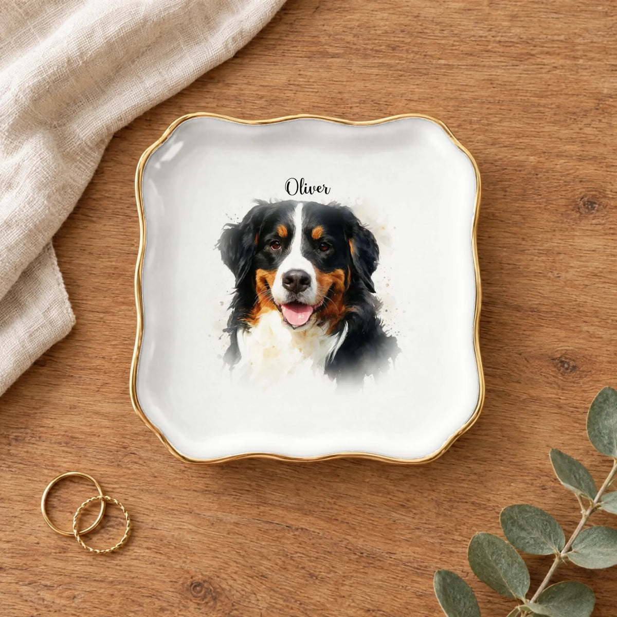 Wavy square watercolor splash pet portrait ring dish on a wooden table with linen and eucalyptus