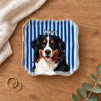 Wavy square striped pet portrait ring dish on a wooden table with linen and eucalyptus