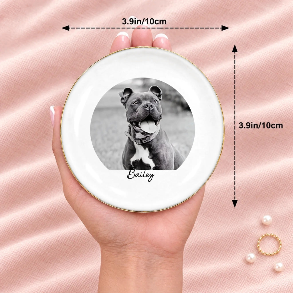 Hand holding a black and white pet photo round ring dish, 3.9 inches across