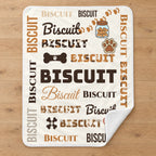Personalized dog name word cloud sherpa blanket laid flat on an oak floor, showing the full design with paw prints, bones and treat jar