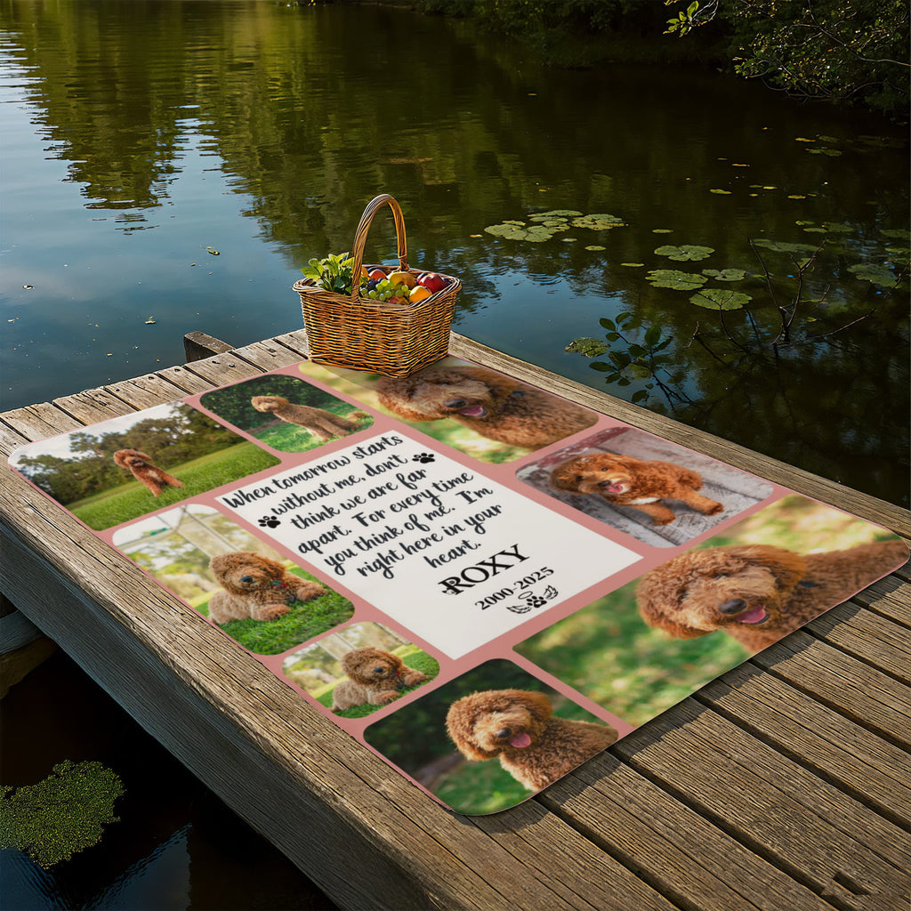 Personalized dog memorial mat with photos of a dog on a wooden dock by a lake.