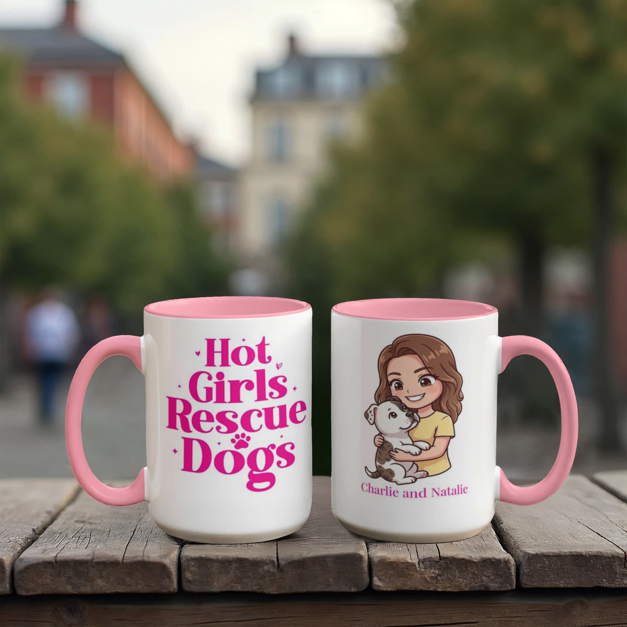 Two mugs with pink interior and handle on a wooden surface, one with text and the other with an illustration of a girl holding a dog.