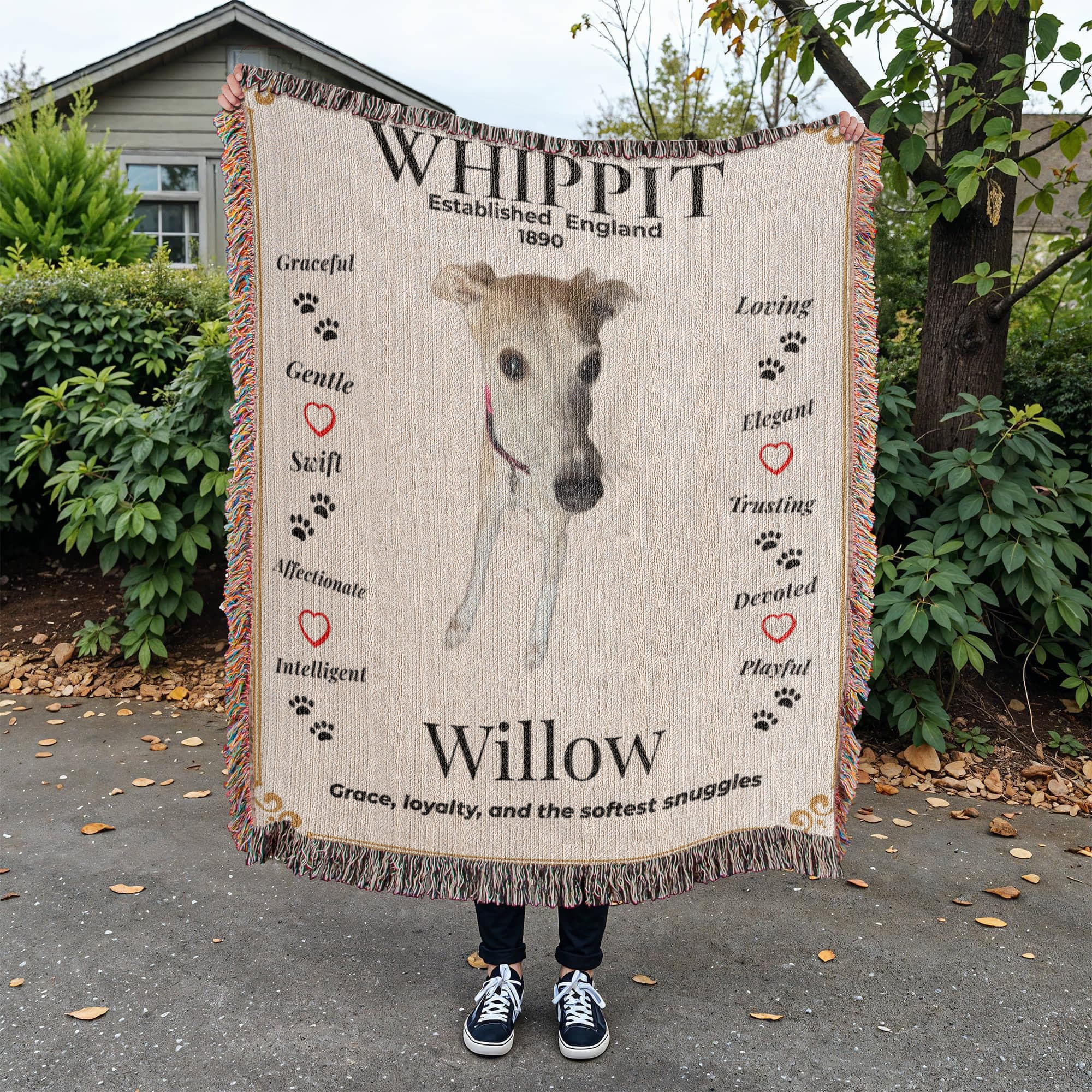 Person holding a blanket with a whippet design and text outdoors. Personalize your Whippit woven blanket with your favorite photo and your dog's name.