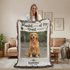 Person holding a personalized blanket with a dog's photo and text in a garden setting
