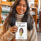 Woman holding a book titled 'Just a Girl Who Loves Dogs' in a bookstore.