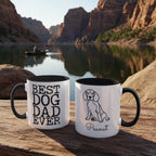 Two mugs with 'Best Dog Dad Ever' and a dog illustration on a wooden surface with a scenic background.