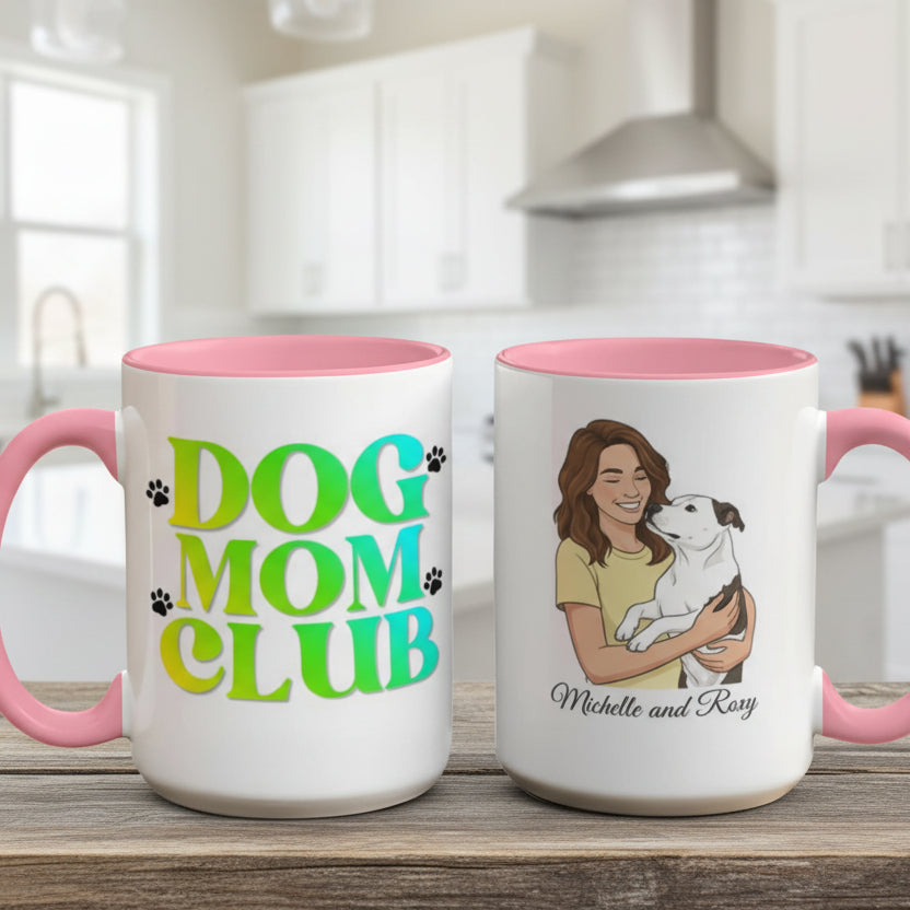 Two mugs with pink interiors on a wooden surface, one labeled 'Dog Mom Club' and the other with a illustration of a woman holding a dog.