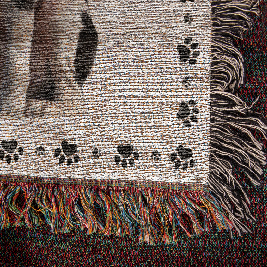 Textured fabric with paw print pattern and colorful fringe
