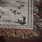 Textile with dog illustrations and text on a textured background