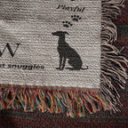 Textile product with a dog silhouette and text on a textured background