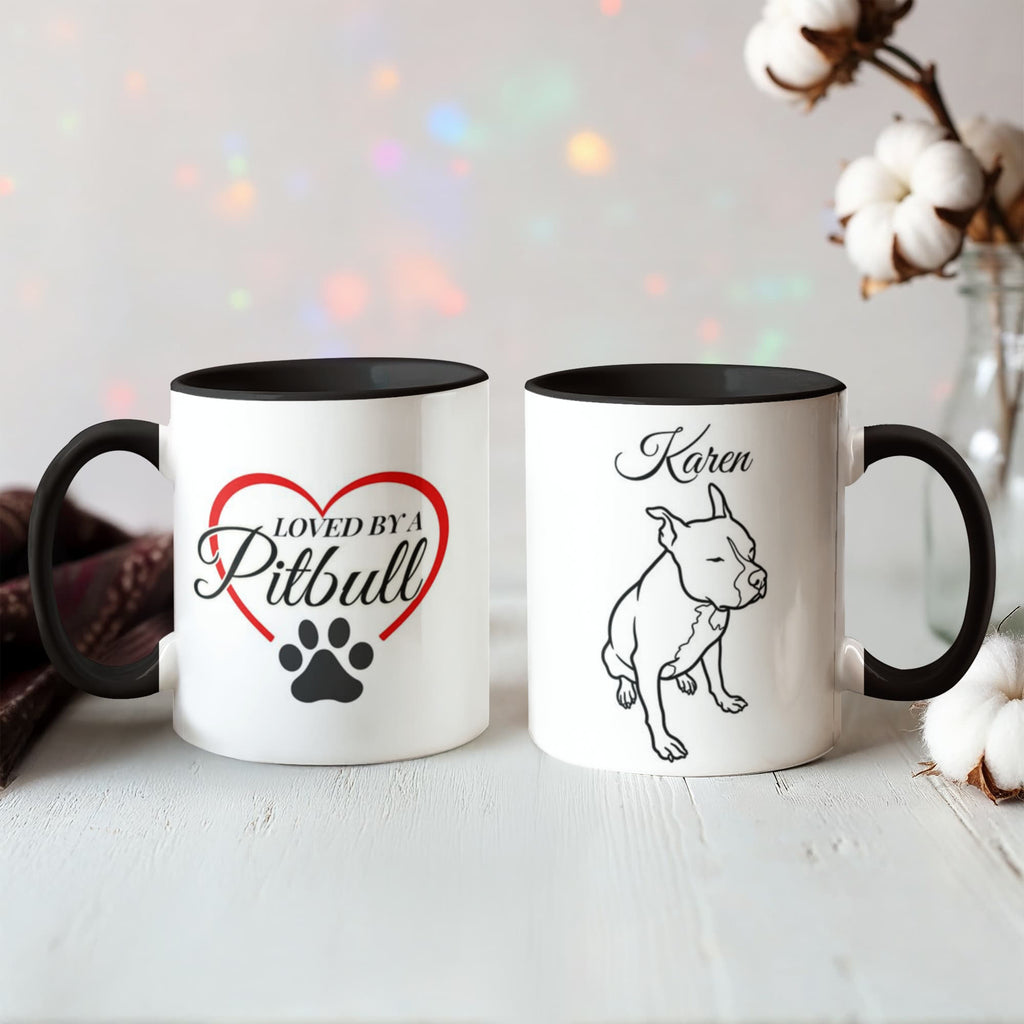 Two white mugs with black interior and handle, featuring a heart and paw print design and a dog illustration.