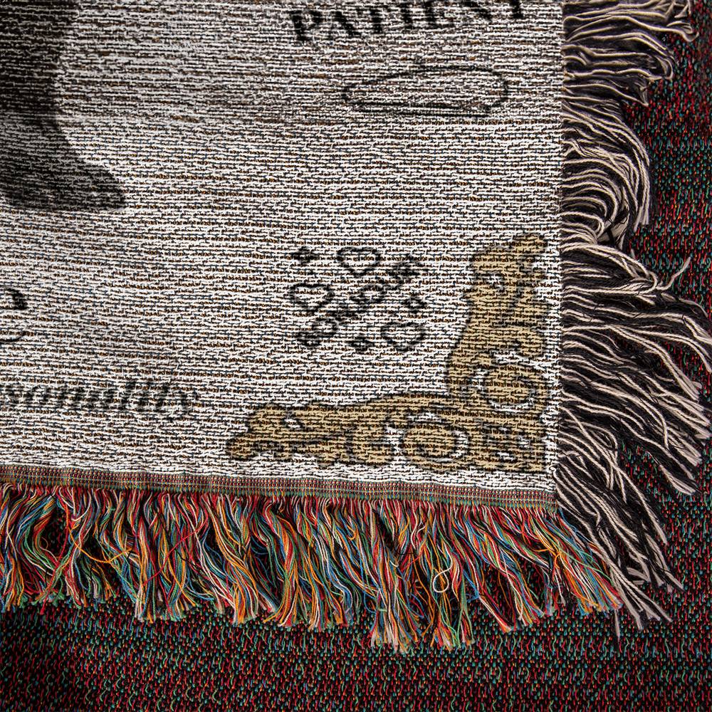 Textile with fringes and printed text on a dark background