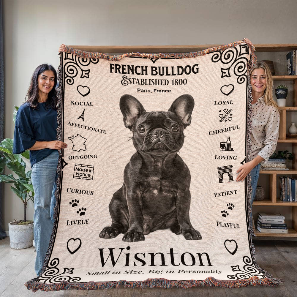 Two people holding a French Bulldog-themed blanket with a dog's name on it.Personalized with your Frenchie's photo and name.