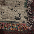 Textile with paw prints and fringes on a textured background
