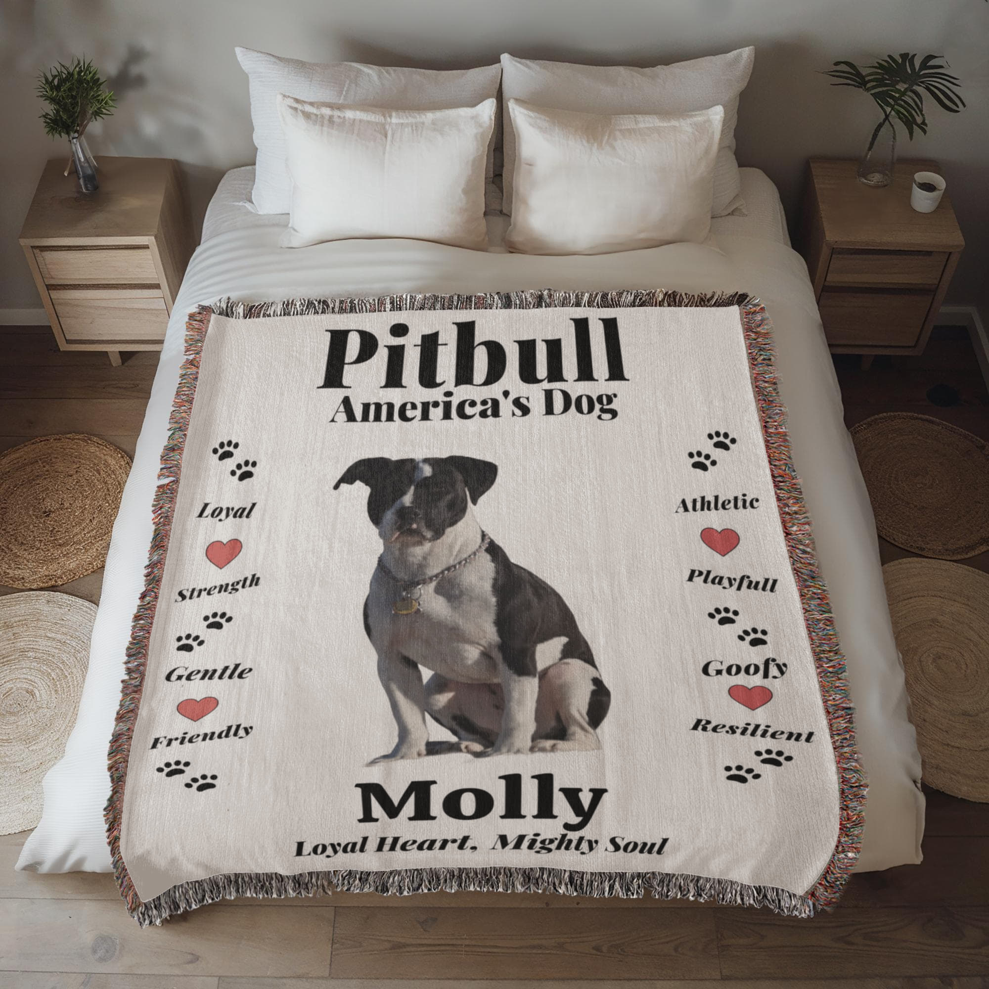 Pitbull-themed blanket with text and a dog illustration on a bed in a bedroom setting.