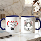 Two mugs with husky-themed designs on a kitchen counter.
