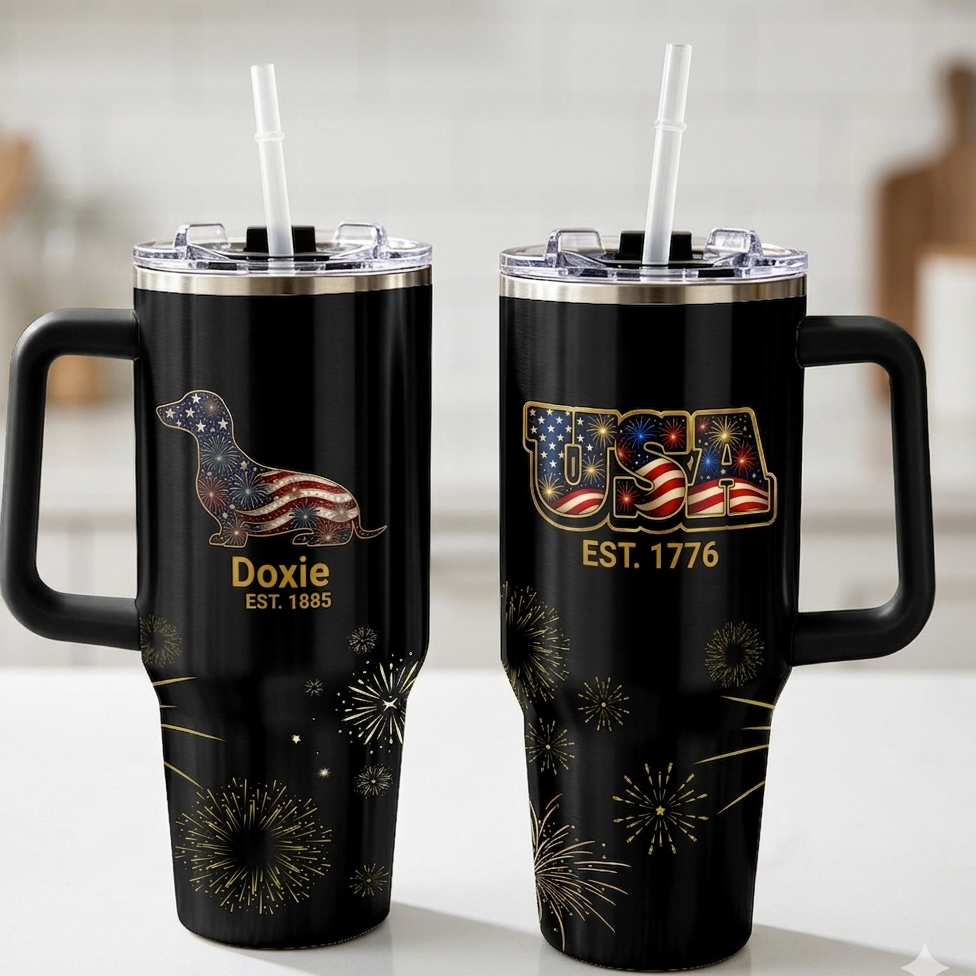 Two black tumblers with patriotic designs on a white surface.