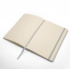 Open notebook with lined pages on a white background