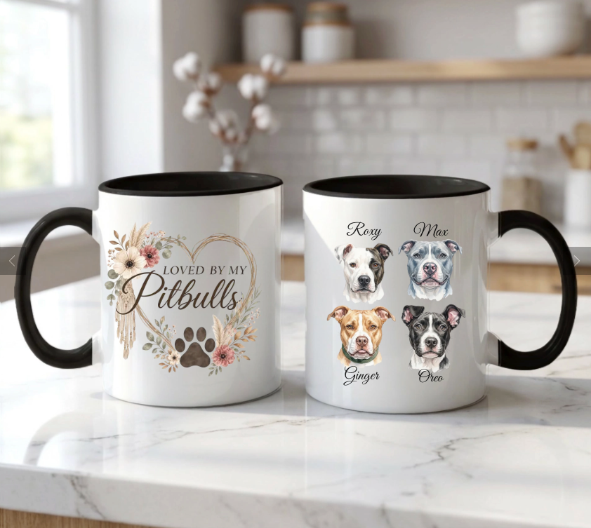 Two mugs with pet-themed designs on a kitchen counter.