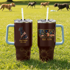 Two tumblers with handles on a table, one featuring a dog design and the other with 'USA' text.