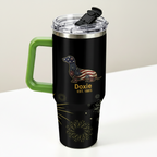 Black travel mug with green handle on a table with donuts and condiments
