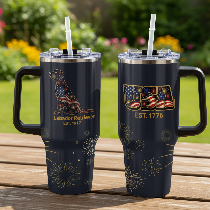 Two tumblers with Labrador Retriever and USA designs on a table.
