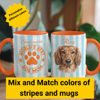 Two mugs with personalized designs and text, one featuring a dog and the other a paw print, on a blurred natural background.