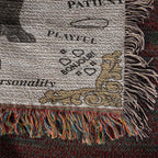 Textured fabric with fringes and printed text on a dark background