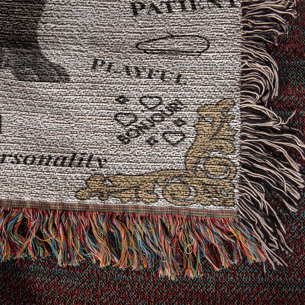 Textured fabric with fringes and printed text on a dark background
