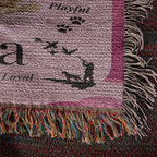 Textured fabric with fringes and text on a dark background