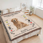 Blanket with a Golden Retriever design and text on a bed in a room.