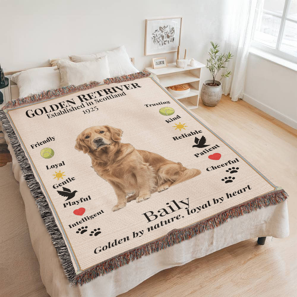 Blanket with a Golden Retriever design and text on a bed in a room.