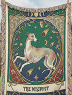 Decorative blanket with a Whippit Tarot card design in front of a castle