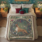 Decorative bedspread with a dog design in a room with floral wallpaper and framed pictures.