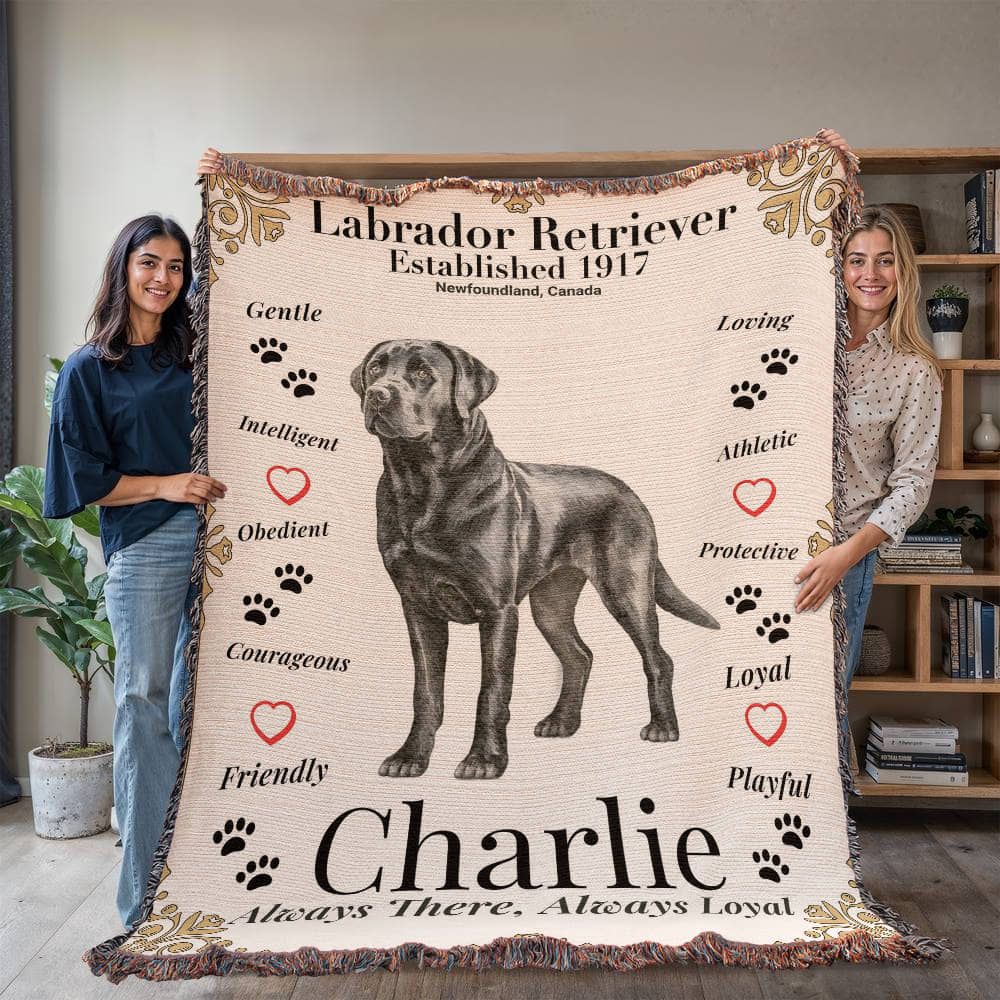 Two people holding a blanket with a Labrador Retriever design and text. Personalize your Labrador Retriever woven blanket with your dog's photo and name.