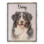 Woven blanket with a dog portrait and the name 'Daisy' on a striped background