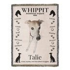 Blanket with a whippet design, text, and paw prints on a beige background
