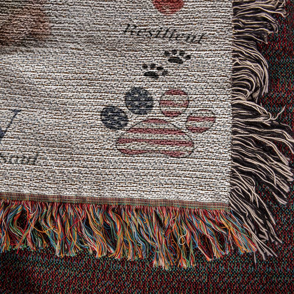 Textile with paw prints and fringes on a textured background