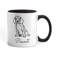 White mug with black interior and handle featuring a dog illustration and the name 'Peanut'.