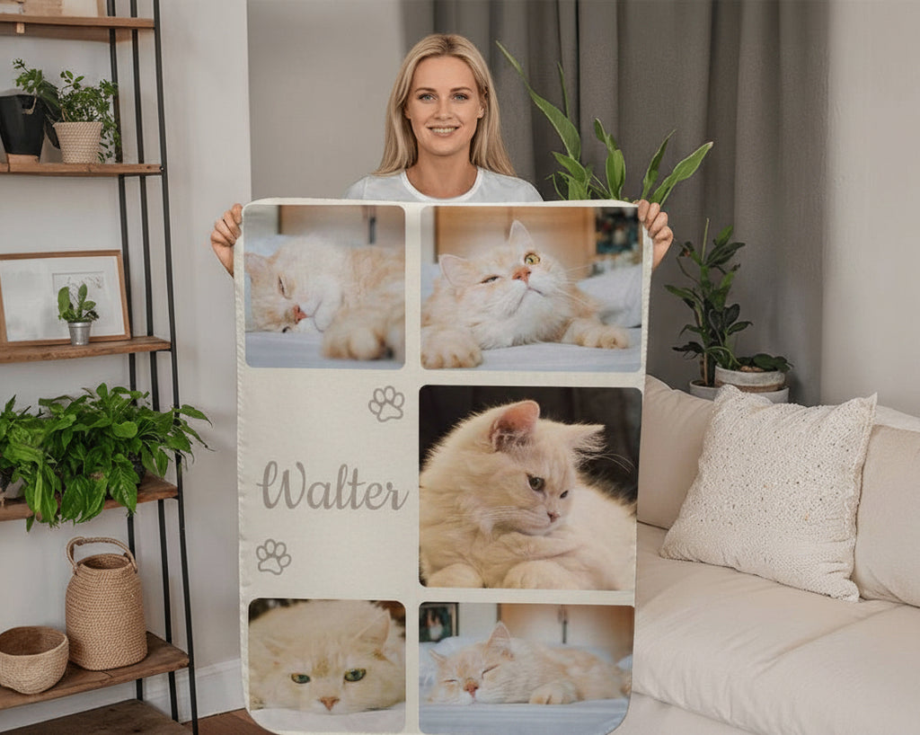 Person holding a blanket with cat photos and the name 'Walter' in a living room.