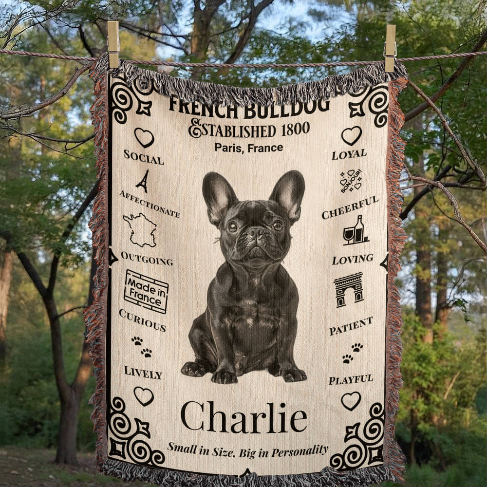 Blanket with a French Bulldog design and text about the breed, hanging outdoors.Personalized with your Frenchie's photo and name.