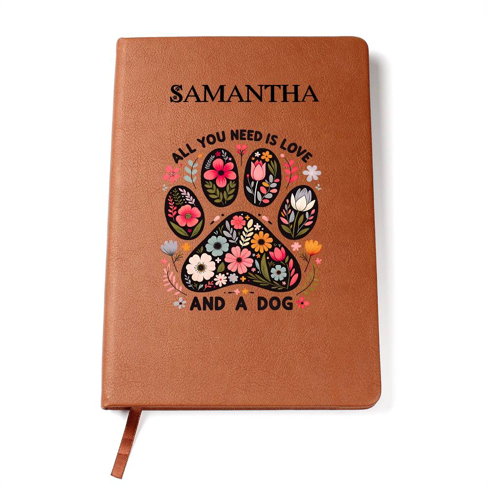 Brown notebook with floral paw design and text on a white background