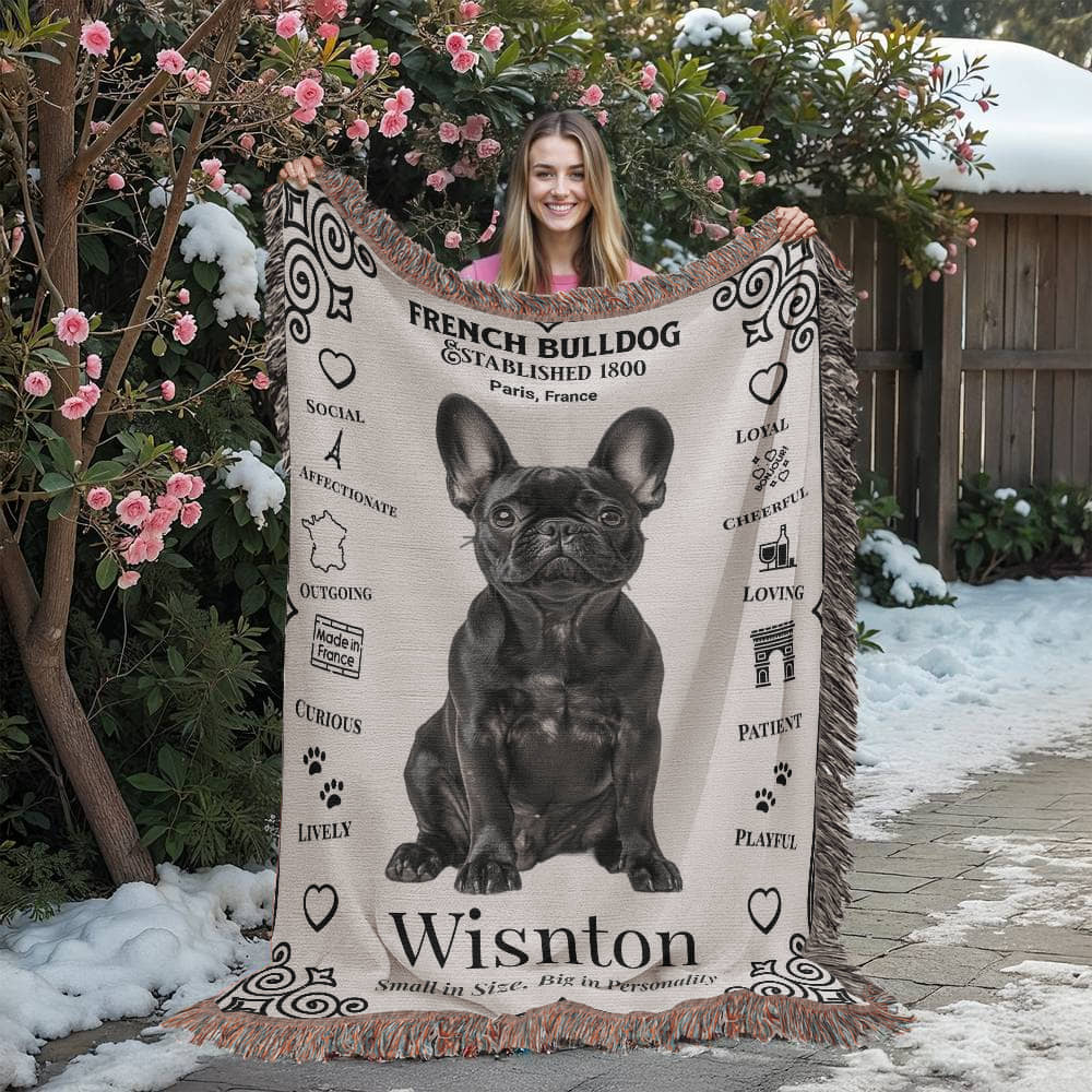 Person holding a French Bulldog-themed blanket with decorative text and graphics.Personalized with your Frenchie's photo and name.