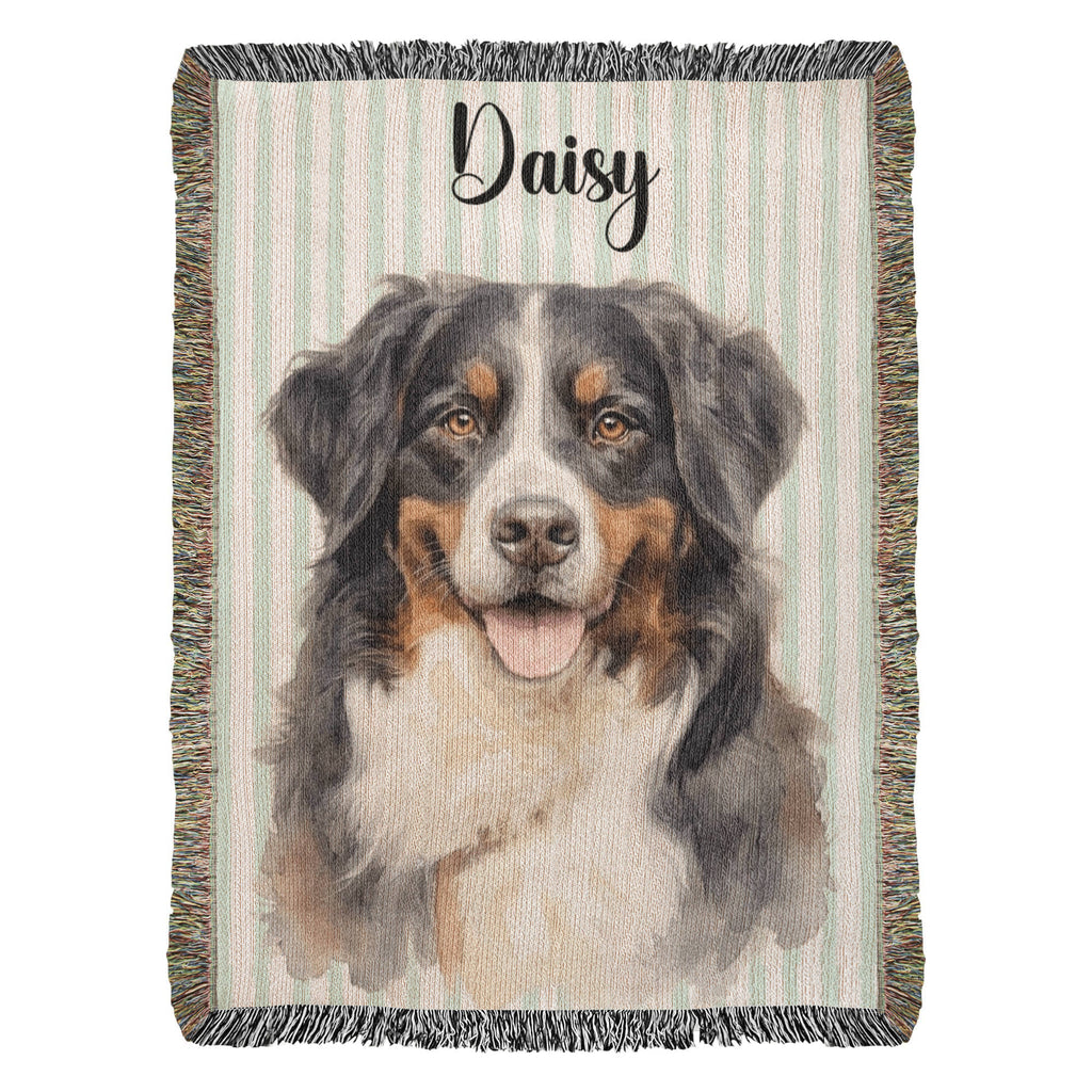 Woven blanket with a dog portrait and the name 'Daisy' on a striped background