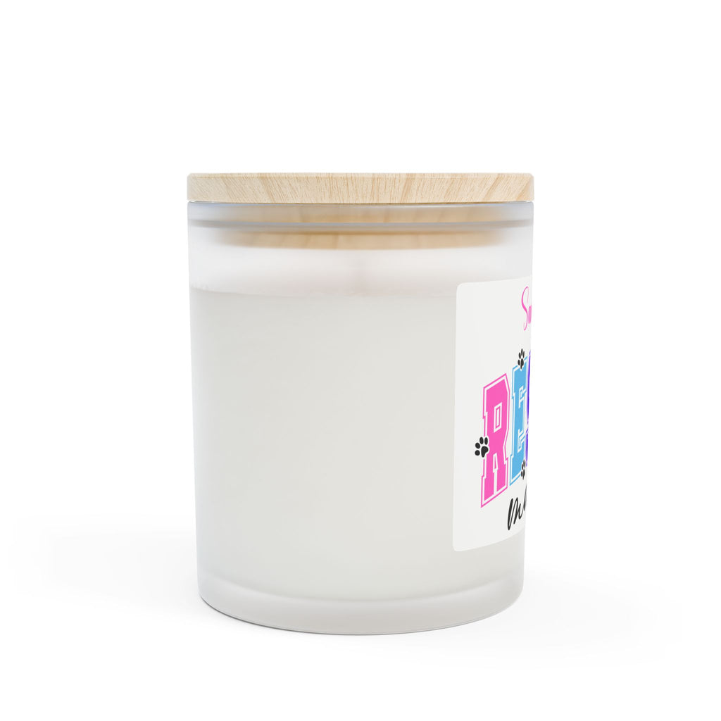 White candle in a glass jar with a wooden lid on a white background
