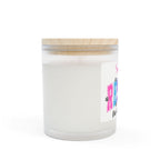 White candle in a glass jar with a wooden lid on a white background