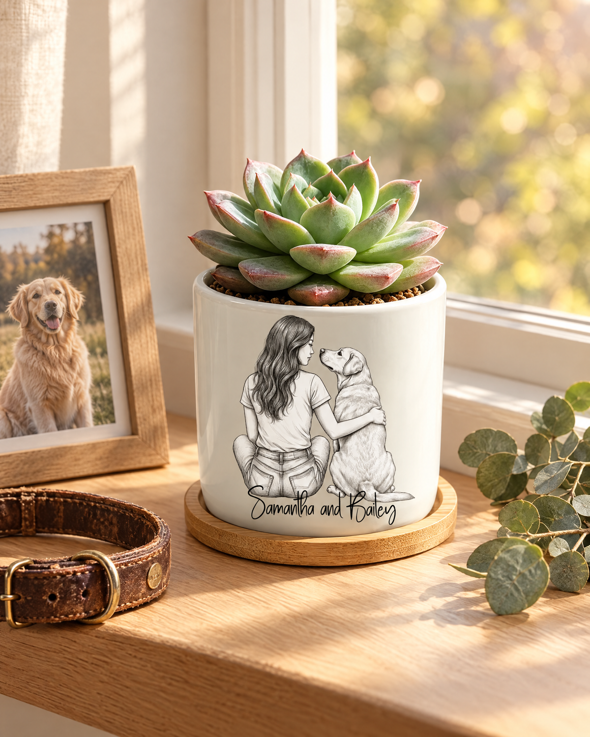 Personalized You Left Paw Prints On My Heart ceramic planter with a sketch of a woman and her dog on a sunny windowsill
